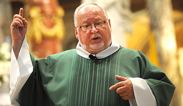 Our Lady of Victory National Shrine & Basilica Celebrant Msgr. Paul J.E. Burked speaks about the legacy of Father Nelson Baker during the 81st Annual Father Baker Day Mass and Celebration. (Dan Cappellazzo/Staff Photographer)