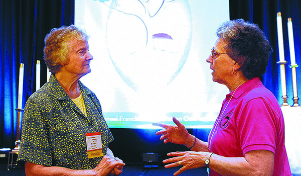 Sister Kathy Uhler, OSF, elected president of the Franciscan Federation, speaks with Sister Concetta DeFelice of Williamsville, at the Adams Mark during the Franciscan Federation Conference held this weekend. (Dan Cappellazzo/Staff Photographer)