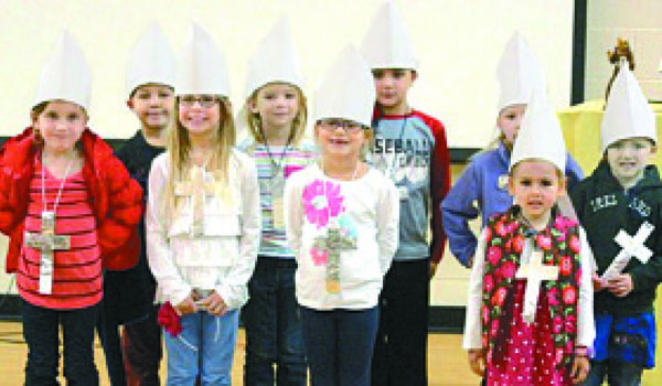 Children at the October Generations of Faith program at St. Mary of the Assumption Parish model miters which they made in the arts and crafts segment of the session. Participants reflected on the life and teachings of Pope Francis. (Courtesy of St. Mary of the Assumption Parish)