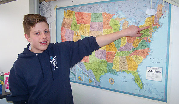 Immaculate Conception eighth-grader Zachary Hawley points to Albany, where he competed in the National Geographic Geography Bee. Hawley represented his East Aurora school in the state championship in April. (Patrick J. Buechi/Staff)
