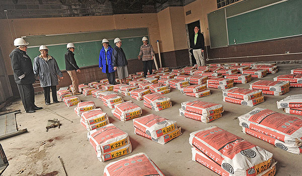 Gerard Place president and CEO David Zapfel (far right) speaks to the sisters who collaborated to start Gerard Place during a tour of the former St. Gerard Hall. The entire complex will become the Gerard Place Community Center located on Bailey Avenue near East Delavan. (Dan Cappellazzo/Staff Photographer)