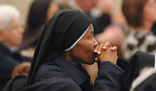 An area nun prays along with Bishop Richard J. Malone as he prays for those who have been abused by area clergy during the Holy Hour of Reparation and Healing at St Joseph Cathedral. (Dan Cappellazzo/Staff Photographer)