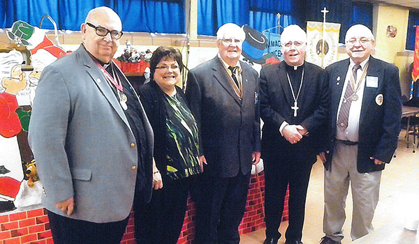 Attendees enjoy the annual Holy Name Society convention at St. Andrew Church in 2015. Enjoying the event are Father Paul Sabo (from left), spritual moderator; Cheryl Calire, director of Pro-Life Activities; Ray Zientara, executive director, Diocesan Union of Holy Name Society; Bishop Richard J. Malone and Peter Carbone, president of the National Holy Name Association. (Courtesy of Diocesan Holy Name Society)