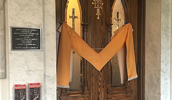 St. Mary of the Angels designed its Mercy Doors with a custom monogram and a vintage gold priests' stole. (Courtesy of St. Mary of the Angels)