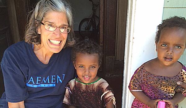 St. Benedict ­Volunteers from St. Benedict Parish and St. Peter Episcopal Church work to clean, furnish and decorate a home for Somali refugees. (Patrick J. Buechi/Staff)