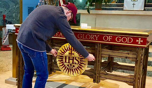 One Jesuit Buffalo members help to install the new Altar and Ambo at St Michael's Church. (Courtesy of One Jesuit Buffalo)
