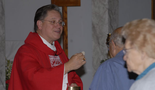 Father Edward `Ted` Jost received a permanent assignment from Bishop Richard J. Malone. (WNYC File Photo)