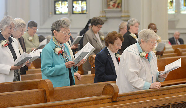 Women and men in consecrated life join Bishop Richard J. Malone in celebration during the Jubilee Mass at St. Joseph Cathedral on April 23. (Patrick McPartland/Staff Photographer)