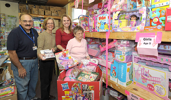 Ladies of Charity Joe Rizzo, community assistant; Margie Pawlowski; Carolyn Kwiatkowski, outreach specialist; and Ceil Borcz, Christmas chairperson, start gathering Christmas donations at the Ladies of Charity headquarters on Broadway Street in Buffalo. (Patrick McPartland/Staff Photographer)