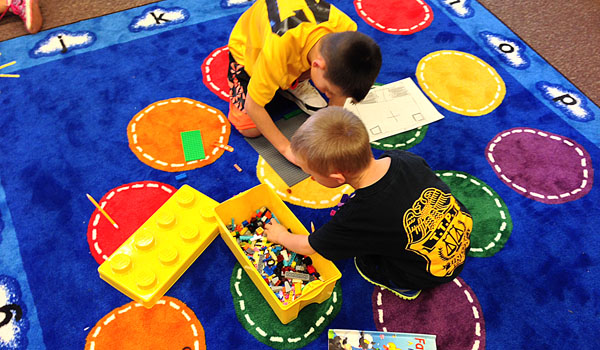 Two students from St. Andrew's Country Day School follow blueprints to build a church out of Legos. Lego bricks have become one of the  educational tools for the STREAM program. (Photo by Kimberlee Sabshin)
