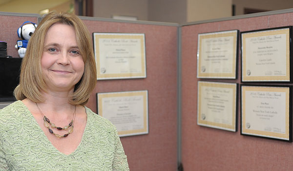 Graphic Designer Carolyn Luick received three Catholic Press Association awards for her work in 2015. (Patrick McPartland/Managing Editor)