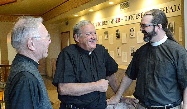 Father Peter Drilling and Father Francis `Butch` Mazur meet with the Rev. Lee Miller from Holy Trinity Lutheran Church to discuss plans for a commemorative prayer service celebrating the 500th anniversary of Martin Luther's posting of the 95 Theses. (Patrick McPartland/Managing Editor)