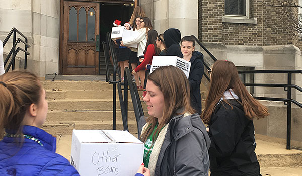 Students from Mount St. Mary Academy's Z-Club pack up over10,000 food items they collected for local shelters. The collection, which ran through November and December, brought food to St. Luke's Mission of Mercy and St. Francis of Assisi Parish in Tonawanda.  