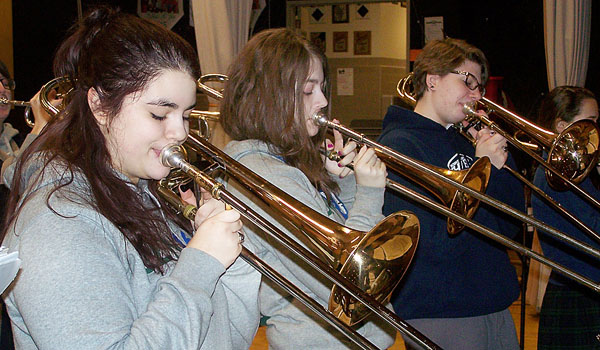 Gabrielle Phillips, Emily Deacon, Abby Skakal and Emma Mack, members of the Mount St. Mary Academy Jazz Ensemble, run through the set list for the Jazz Fest concert at Banchetti by Rizzo's in Amherst. The Kenmore school has the only all-girl jazz band in Western New York. (Patrick J. Buechi/WNYC Staff)