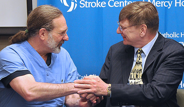 Tom Witakowski, a music professor at Buffalo State College and conductor, thanks Dr. Lee Gutermann during a press conference at Mercy Hospital. The doctor was part of the stroke team that saved his life. May is National Stroke Awareness month. (Dan Cappellazzo/Staff Photographer)