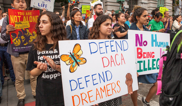 Protesters hold various signs and banners at the Deferred Action for Childhood Arrivals, or DACA, rally in San Francisco. (Funcrunch Photo)