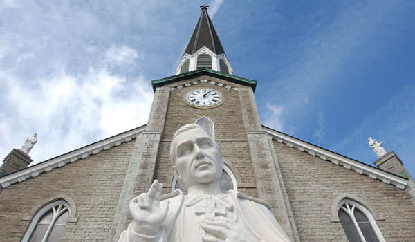 A statue of founded by St. John Neumann stands outside SS. Peter and Paul Parish in Williamsville. (File photo)