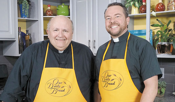Father Paul Seil (left) welcomes 'In a Word' host Father Dave Richards to this month's `Our Daily Bread.` (Courtesy of Daybreak TV Productions)