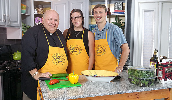 On this episode of `Our Daily Bread,` host Paul D. Seil is in the kitchen with Jesse and Sarah Salterelli, a young couple who have chosen to dedicate themselves to fostering Catholicism in youth in parishes in Western New York. (Courtesy of Daybreak TV Productions)
