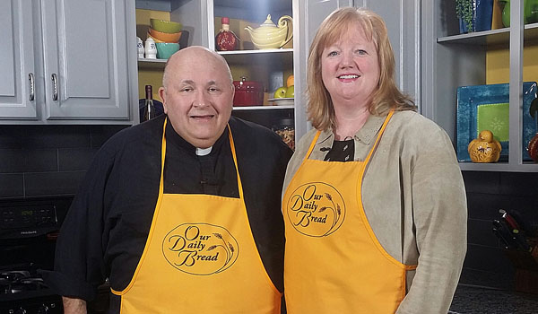 Tara Hughes, trafficking services coordinator at the International Institute of Buffalo, joins `Our Daily Bread` host Father Paul D. Seil in the kitchen.
