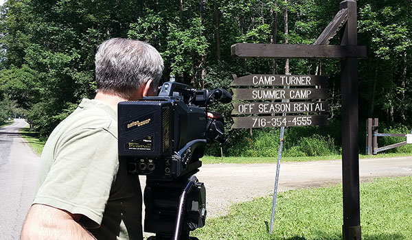 Daybreak TV videographer Andy Golebiowski records footage for the upcoming `Our Daily Bread` episode on Camp Turner.