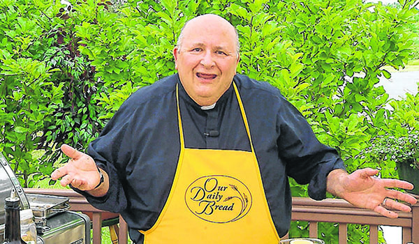 On this month's `Our Daily Bread,` Father Paul D. Seil cooks at the Mother Teresa Home on Buffalo's East Side. (Courtesy of Daybreak TV Productions)