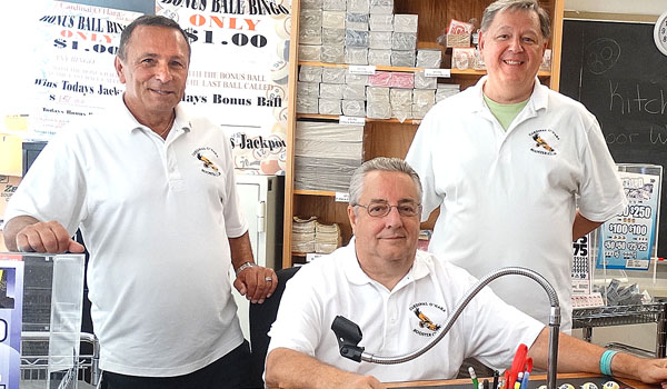 Booster Club members Tony Saletta (left to right), John Heimback (seated) and Bob Loeffler are ready to call the first game of Bingo at Cardinal O'Hara High School. (Courtesy of Cardinal O'Hara High School)