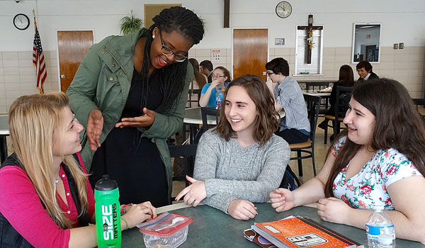 Cardinal O'Hara High School students welcome their international counterparts throughout the school year, including a class in Chinese taught by Yuqi Pang to 30 American students. Enjoying a conversation at lunch are, from left, Dora Sarkany who is from Hungary; Desange Kamikazi, Mary Catalfamo and Katie Hatzipetros. 
(Courtesy of Cardinal O'Hara High School)