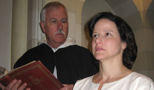 Colleen Marcello as Joan of Arc and Mike Randall as Brother Dominic appear in the St. Joseph University Parish Opera Sacra production of `Joan of Arc at the Stake.` (Courtesy of St. Joseph University Parish)