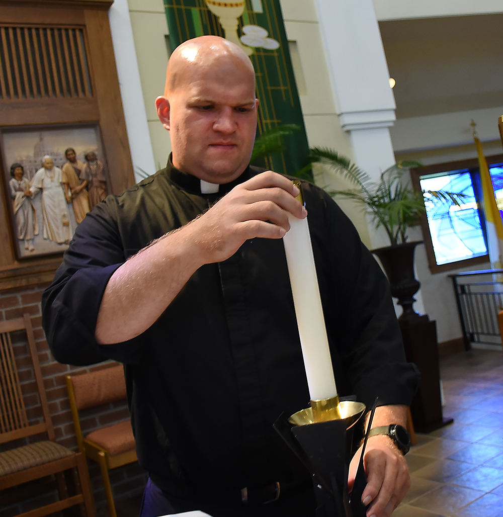 Deacon Chris Emminger walks the grounds of John Paul II Church. Emminger along with Deacon Denning Achidi will be ordained at Our Lady of Victory Church on September 19th. 