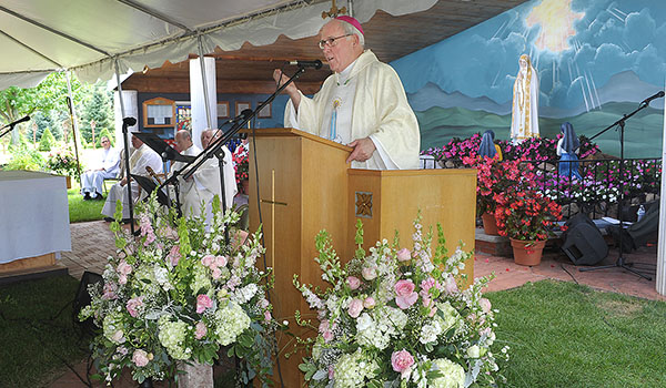 Bishop Richard J. Malone delivers the homily at St. Padre Pio Parish's Our Lady of Fatima Shrine site in Elba. The parish celebrated the 70th anniversary of the site with a concert, Mass and community reception. (Dan Cappellazzo/Staff Photographer)