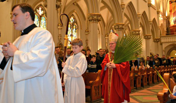 Bishop Richard J. Malone prepares to start the Palm Sunday Mass at St. Joseph Cathedral March 29.