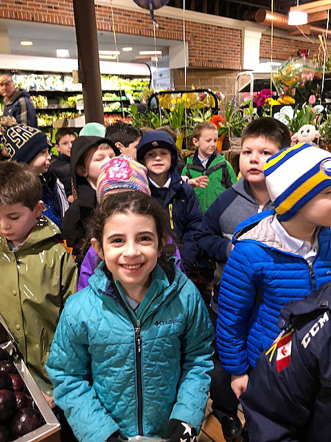 Courtesy of John the Baptist School

First Grader Sophia Privitera shops for pasta for the Response to Love Center at Dash's Market on Colvin Boulevard.
