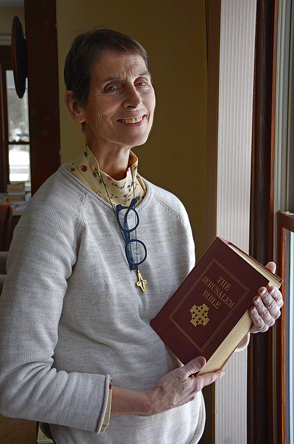  Pastoral Administrator of St.George Church, West Falls, Sister Lori High, SSMN, holds the Bible in her office.
(Dan Cappellazzo/Upstart NY)