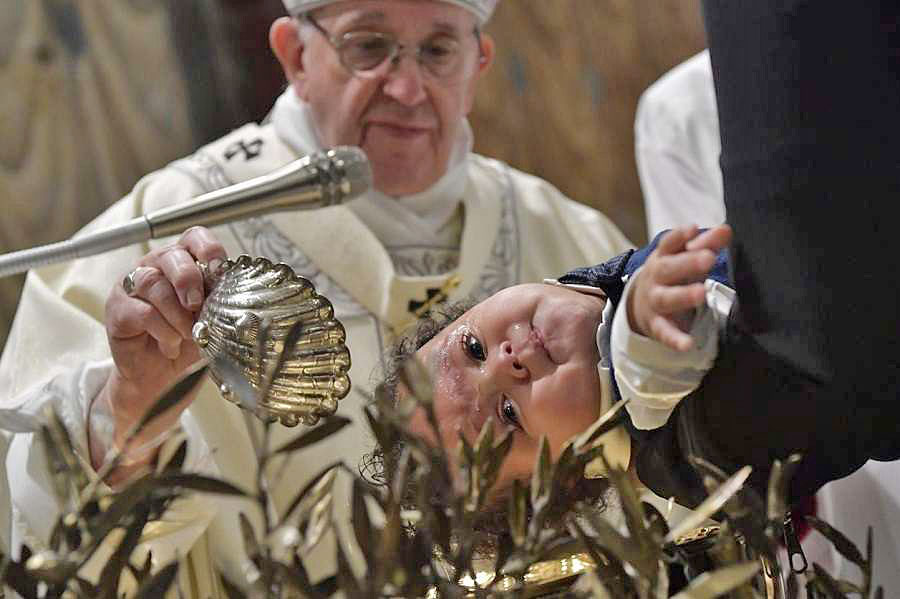(Courtesy of Vatican Media CNA)
Pope Francis baptizes a baby in the Sistine Chapel.
