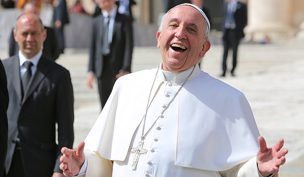 Pope Francis laughing outside of St. Peter's Basilica during the general audience on April 1, 2015. (Bohumil Petrik/CNA)