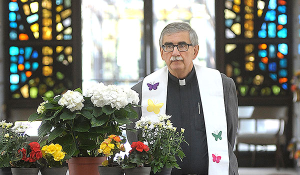 Father Richard `Duke` Zajac, chaplain for Sisters of Charity Hospital, presides over a special burial service at Mount Olivet Cemetery. (Dan Cappellazzo/Staff Photographer)