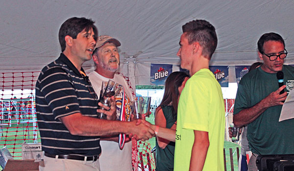 Former Buffalo Sabre Andrew Peters and Father Bob Gebhard present awards at the St. John Vianney 5K Run and Walk post race party.