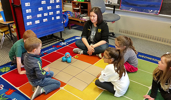 Kindergarten teacher Tara May uses Dash and Dot Robotics to introduce her students to coding at St. Stephen School. (Courtesy of St. Stephen School)