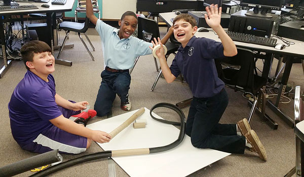 Nathan Wiesnewski, Jahveer Williams and Greyson Settipane were among the students who learned how to build their own rollercoasters at St. John Vianney School in Orchard Park.