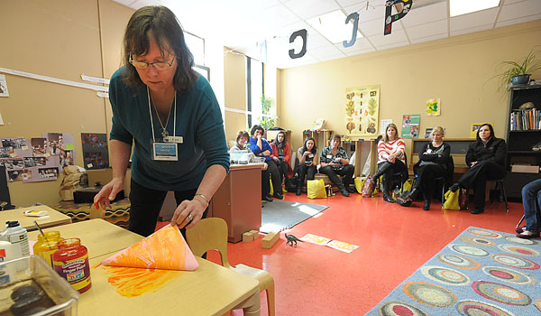 Buffalo Museum of Science Staff member Karen Murphy transfers finger paint from the table onto paper as teachers from STREAM Schools take part in a professional development program at the Buffalo Museum of Science.
(Patrick McPartland/Staff Photographer)