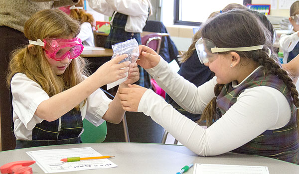 Students of St. Joseph School of Batavia investigate and work together during their STREAM activities. (Courtesy of St. Joseph School Batavia)