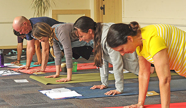 Area Catholics take part in SoulCore in Tonawanda. SoulCore is an exerciese meditation to the rosary that trains Catholics to use exercise in conjunction with reflection and prayer. (Dan Cappellazzo/Staff Photographer)