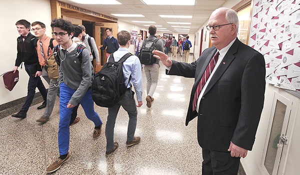 Robert Scott, St. Joseph's Collegiate Institute president, keeps on eye on students as the day ends. Scott will retire at the end of the school year after a 48-year career at St. Joe's. (Dan Cappellazzo/Staff Photographer)