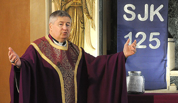 St. John Kanty administrator Father Michael H. Burzynski celebrates Mass during the parish anniversary event. (Dan Cappellazzo/Staff Photographer)