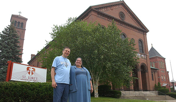 Norm Paolini and Amy Betros welcome all who come to St. Luke's Mission of Mercy. 