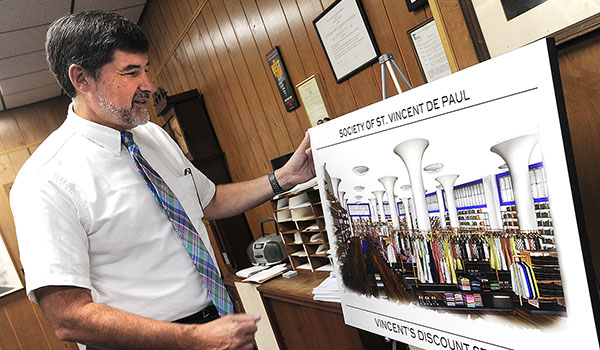 St. Vincent De Paul executive director Mark Zirnheld looks over renovation plans for the Main Street facility, which is celebrating its 170th anniversary. (Dan Cappellazzo/Staff Photographer)