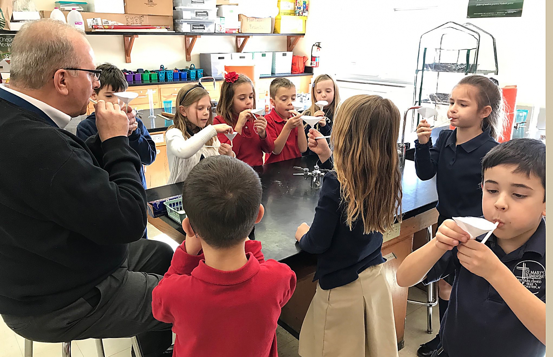 St. Mary's Elementary School Mr. Malachowski's second grade class performs a lab experiment in the school's science lab.