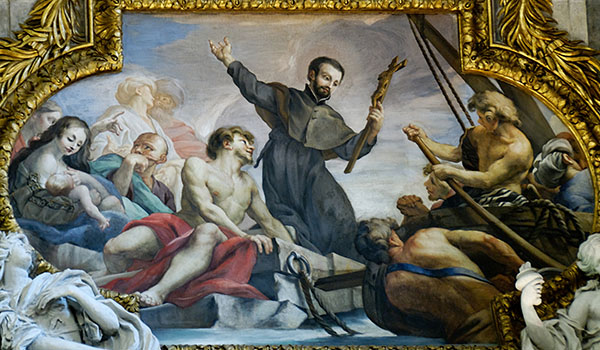 The legacy of St. Francis Xavier, depicted here holding a cross in a chapel painting in Rome, is still celebrated at St. Michael Church in Buffalo. (Wikipedia Commons)