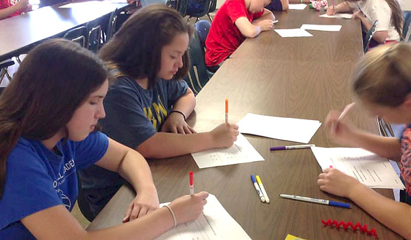 The students of St. John Vianney School test out many designs in a school-wide `Gear Up for Engineering Day.` Classroom teachers chose a challenge for their students to work on, and the entire school participated at the same time.